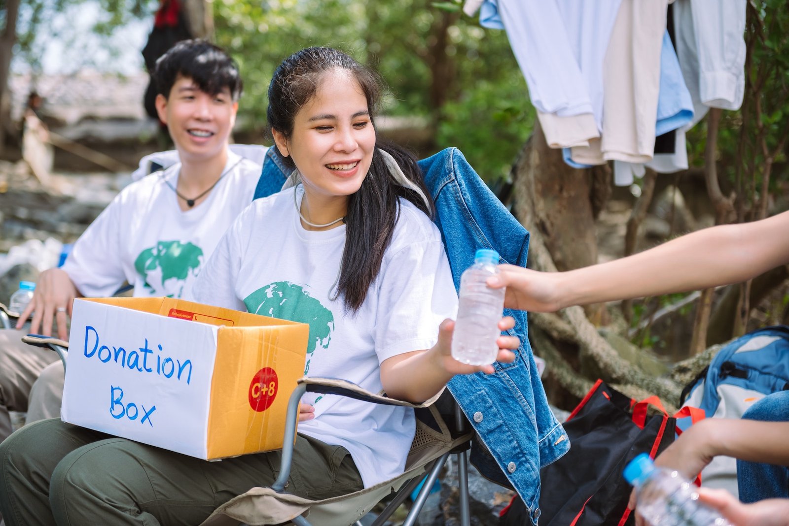 group-of-asian-diverse-people-volunteer-holding-a-donation-box-for-fundraiser-to-emergency-situation.jpg