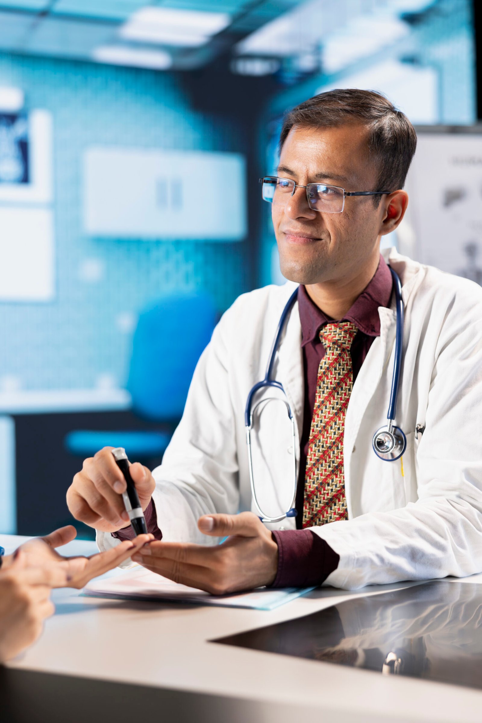Medical consultation with physician using an insulin injector for a patient suffering from diabetes, diagnostics and treatment. Indian doctor using insulin pen in a modern healthcare facility.